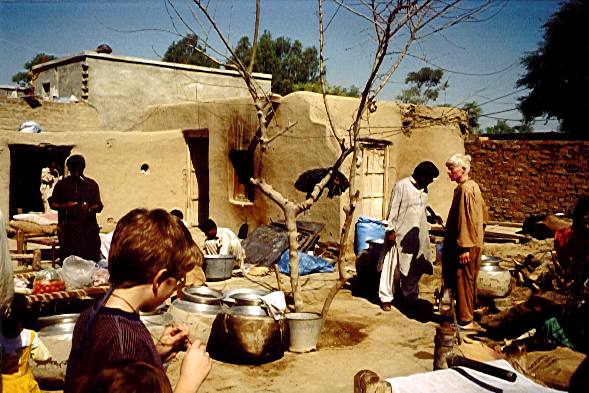 The wedding feast preparations in the village.
